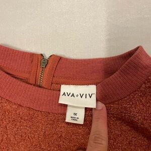 Rust orange crew neck with zipper on the back